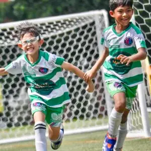 Football for schools Singapore youth football team smiling during training programme in Singapore