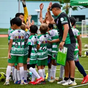 football coaching schools groups Singapore football coach guiding young players during SYL Singapore Youth League match