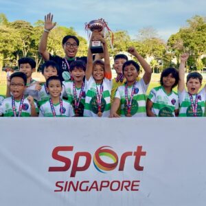 kids celebrating SYL football league trophy win in Singapore